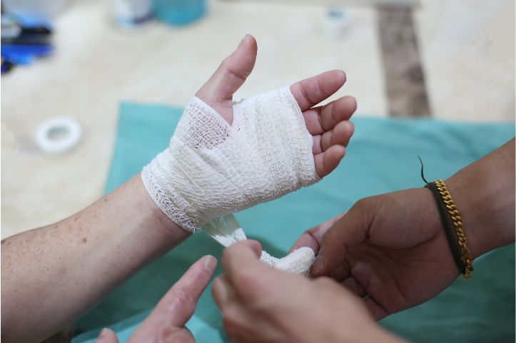 Wound Dressing: Applying bandages, gauze, or dressings to injuries.