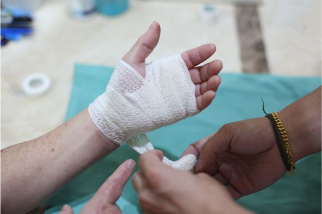 Wound Dressing: Applying bandages, gauze, or dressings to injuries.
